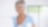 Smiling woman using laptop at home