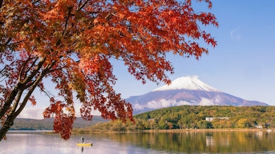 Lake with snow topped mountain in the distance