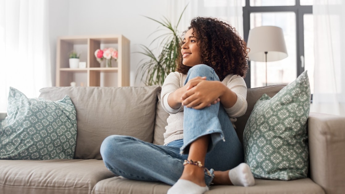 Happy woman relaxing at home
